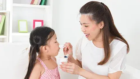 Mom feeding child