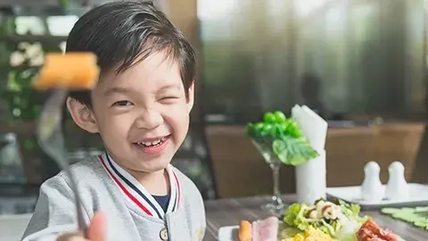 Child eating healthy food